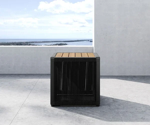 Luxury teak outdoor side table with modern metal frame on a resort patio