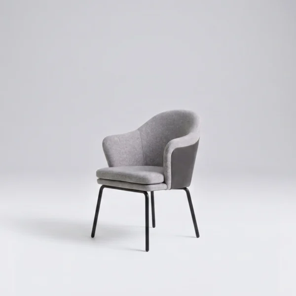 Alia chair contemporary two-tone upholstered armchair in a bright studio setting.