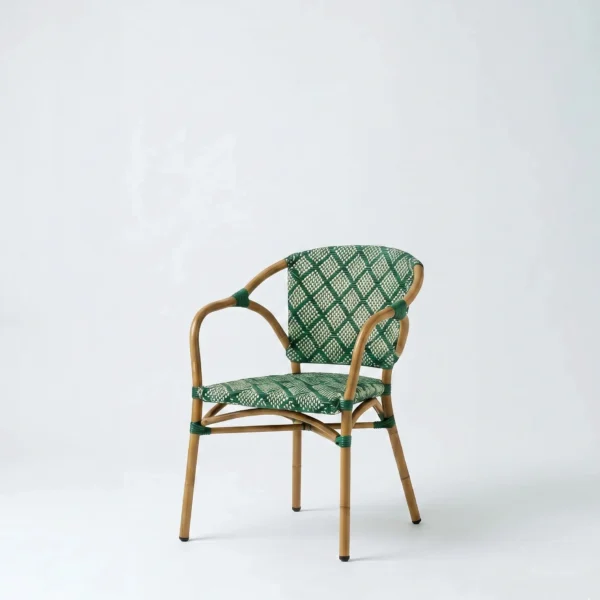 Alya arm dining chair featuring a sleek aluminum frame with a premium woven rattan texture look.