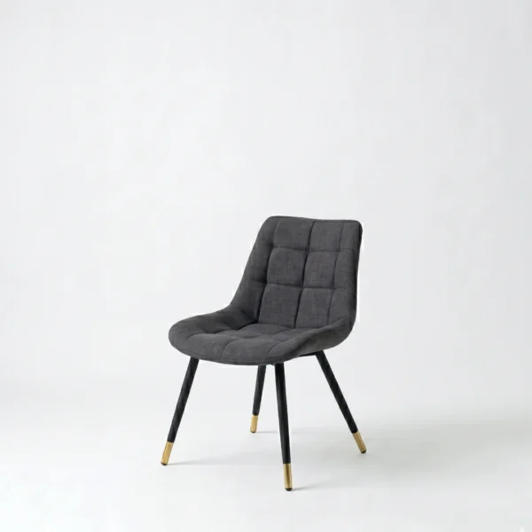 Pereli dining chair mid-century modern-inspired accent chair in a studio setting.