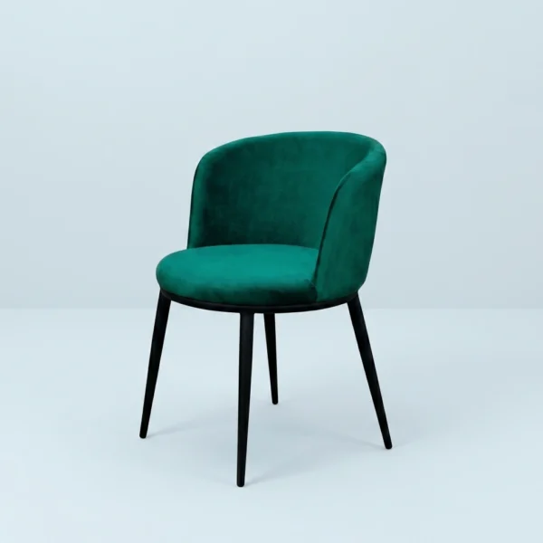 Urbano dining chair upholstered in rich jewel-toned emerald green velvet.