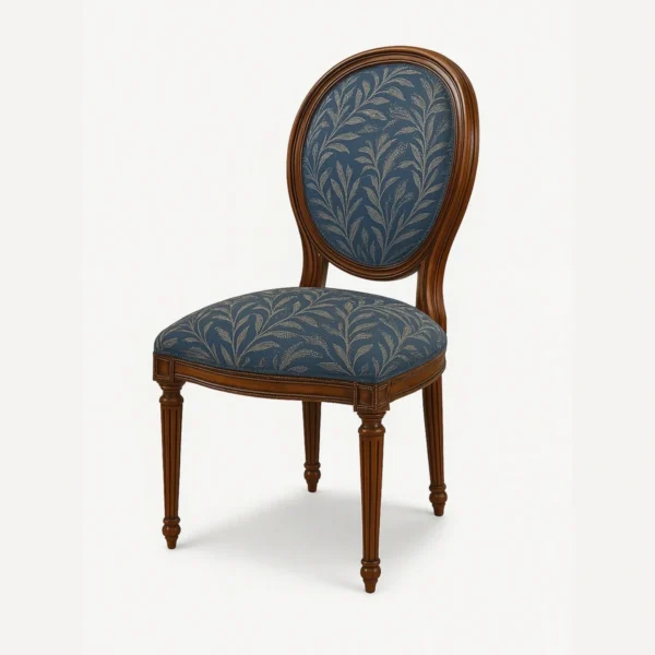 Kopi Classic colonial style dining chair featuring a hand-carved teak wood frame and upholstered oval backrest.